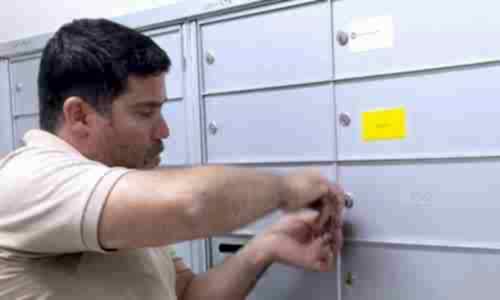 Silver State Locksmith technician rekeying a bank of mailbox locks