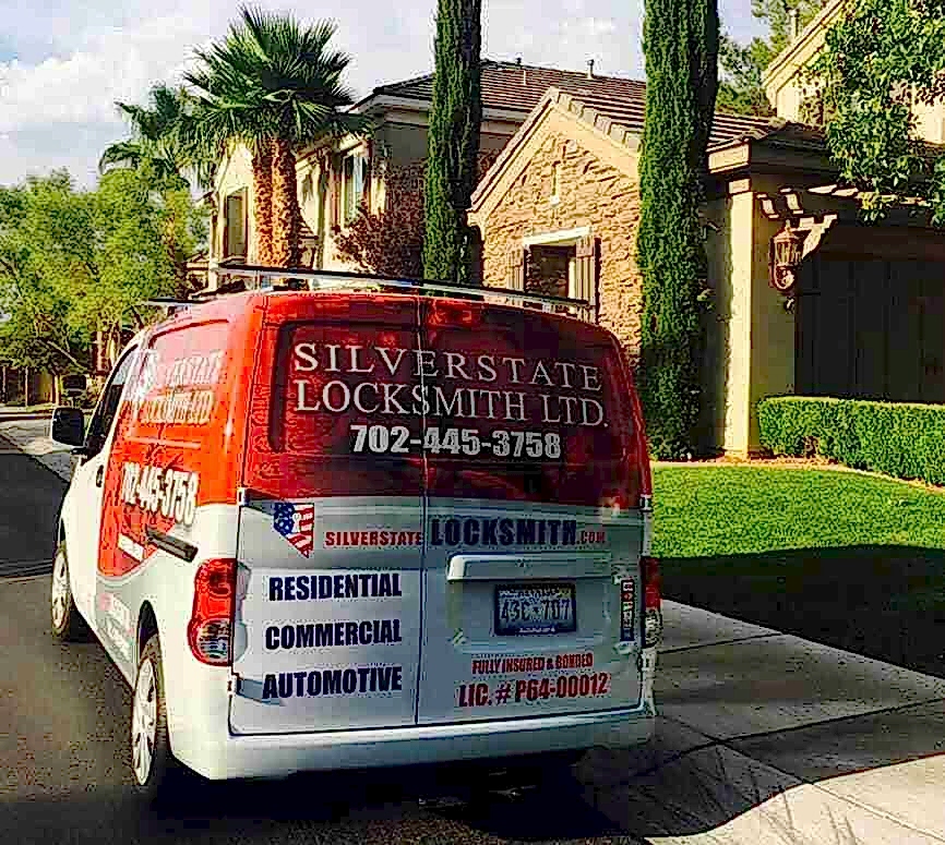 Silver State Locksmith residential technician rekeying a front door lock in a new home